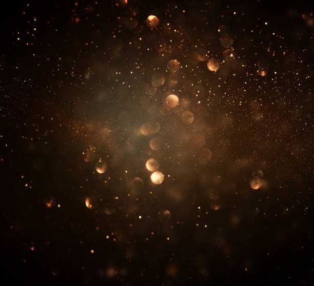 istock glitter vintage lights background. dark gold and black. de focused. 963448780