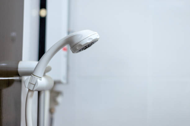 istock white shower head in a bathroom with soft-focus and over light in the background 963448874