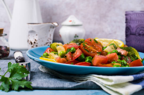 Salad with raw slices of vegetables Salad with raw slices of vegetables in a dish on the table. Selective focus. kosher starter recipes stock pictures, royalty-free photos & images