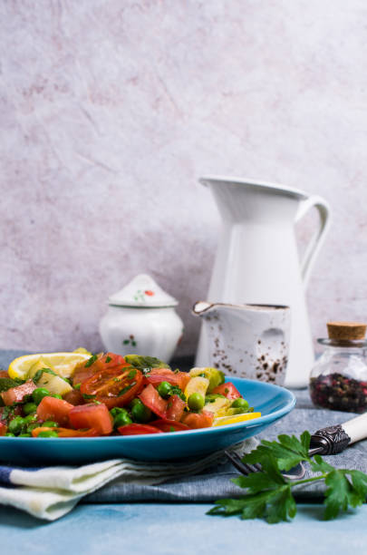 Salad with raw slices of vegetables Salad with raw slices of vegetables in a dish on the table. Selective focus. kosher starter recipes stock pictures, royalty-free photos & images