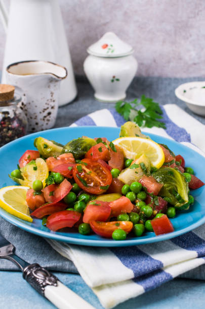 Salad with raw slices of vegetables Salad with raw slices of vegetables in a dish on the table. Selective focus. kosher starter recipes stock pictures, royalty-free photos & images