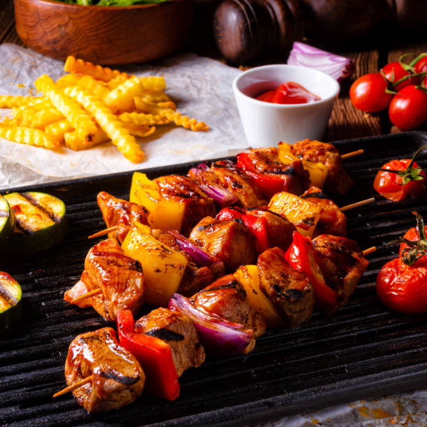 istock Rustic shish kebab skewers with marinated ham meat paprika and red onion 963452568