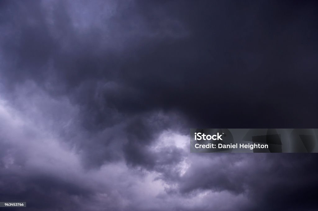 GREY STORM CLOUDS GREY STORM CLOUDS IN SKY BACKGROUND Hopelessness Stock Photo