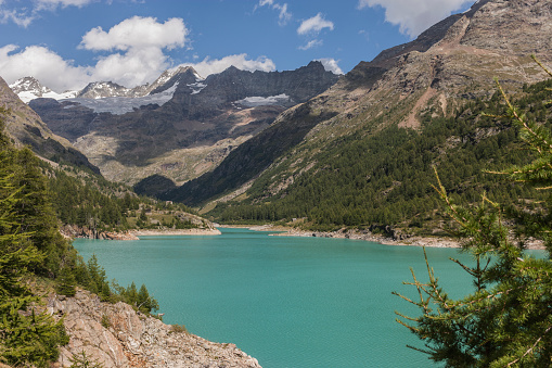 Valpelline, Aosta Valley, Italy. Artificial lake of Place Moulin, with Tête de Valpelline, Dent d'Hérens and Grandes Murailles in the background, near the border with Switzerland