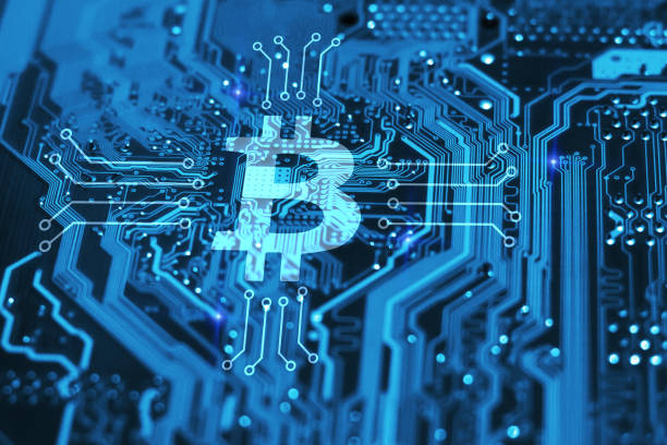 istock Bitcoin cryptocurency concept on blue integrated circuit on background. Blockchain technology concept. 963458534