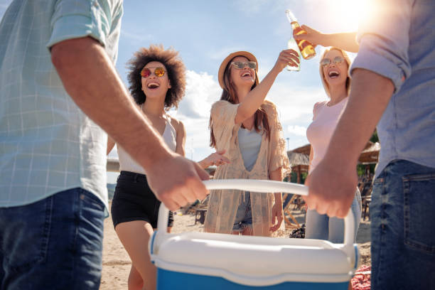 Happy young people having party on the beach. Happy young people having party on the beach.Summer holidays,people,friendship,fun and  vacation concept. beer crate stock pictures, royalty-free photos & images