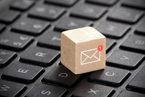 istock New email graphic on wooden block over laptop keyboard 963463804