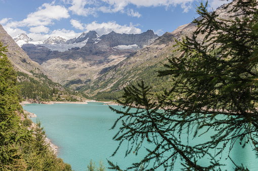 Valpelline, Aosta Valley, Italy. Artificial lake of Place Moulin, with Tête de Valpelline, Dent d'Hérens and Grandes Murailles in the background, near the border with Switzerland