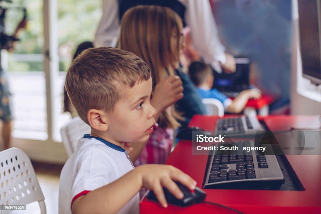 Kid Using Computer Stock Children Using Computers Stock Photo - Download Image Now - Adult, Back ...