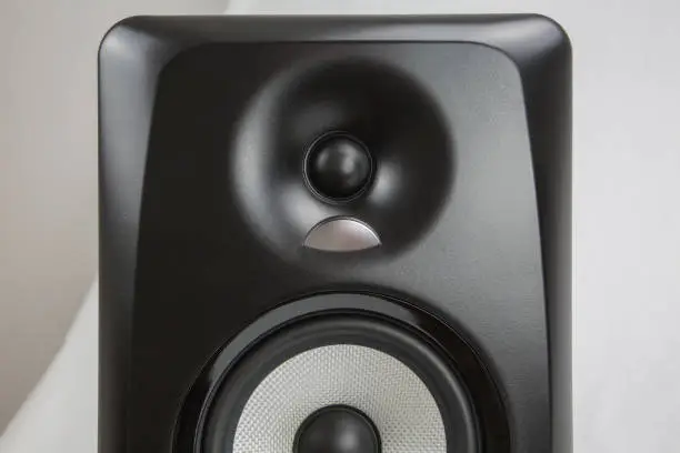 single black professional sound studio monitor on white background