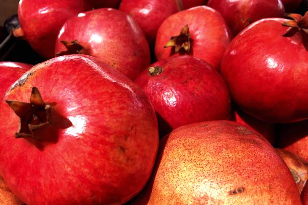 istock red fruit pomegranate on store shelves 963507368