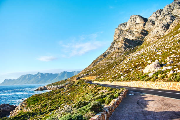 istock Seaside road at sunset Boland Mountain Complex, Western Cape 963510920