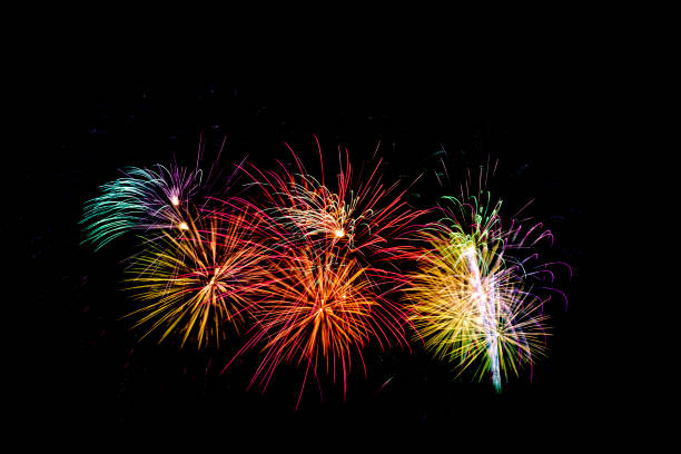 istock Beautiful colorful isolated firework display for celebration happy new year and merry christmas on black background 963513660