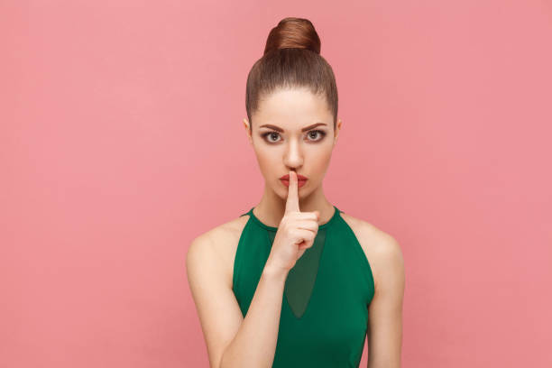 istock Woman showing shh, silence sign 963513950