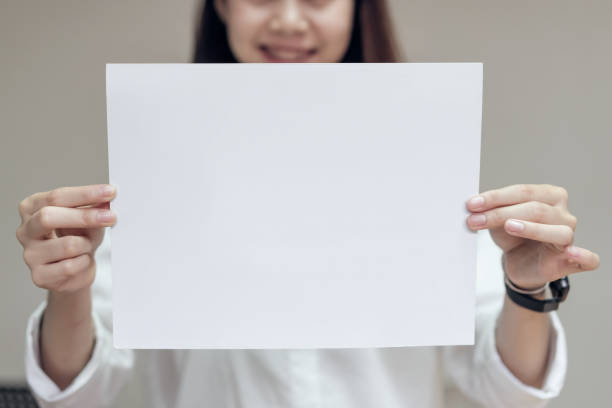 istock Business woman hold blank white card. for text banner. 963519196