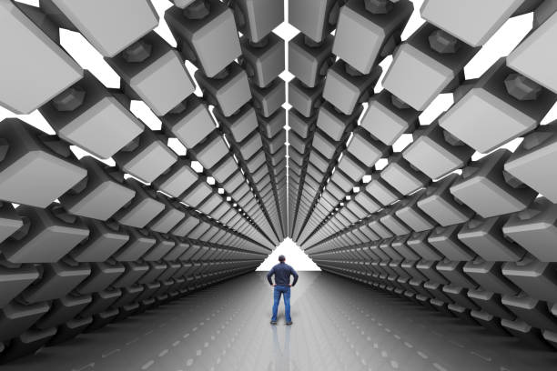 istock Man is standing in a huge dark futuristic hall with a passage going to perspective 963523044
