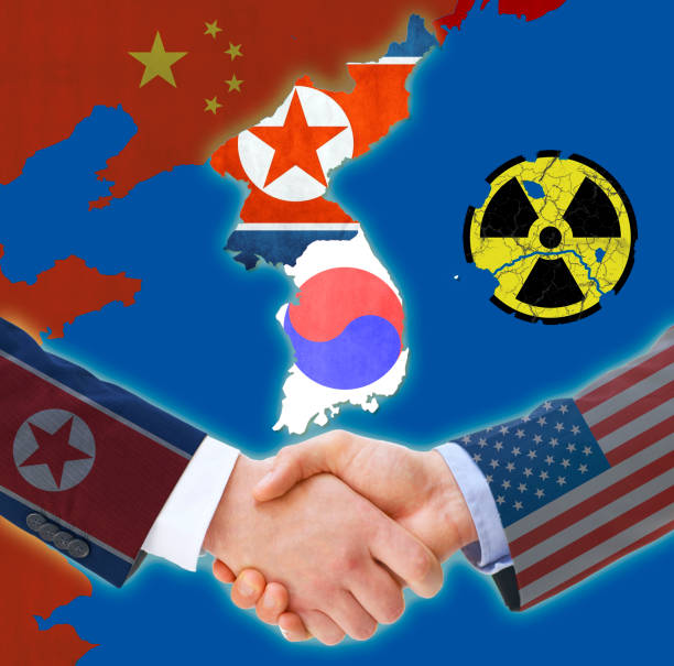 shaking hands for peace on the korean peninsula - korean peninsula imagens e fotografias de stock