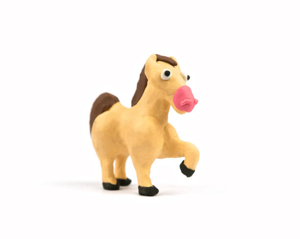 istock Cute horse modeling clay isolated on white background. Handmade plasticine. Close up. 963532448