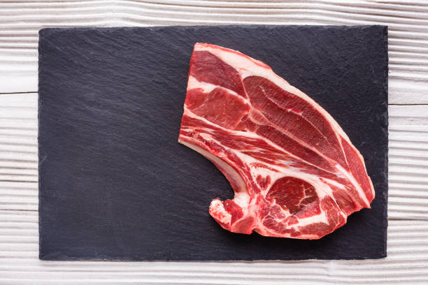 istock fresh lamb meat on a textured stone plate 963533084