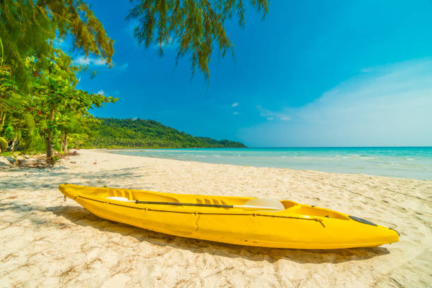 istock Yellow Boat On Beach By Sea Against Sky 963533138