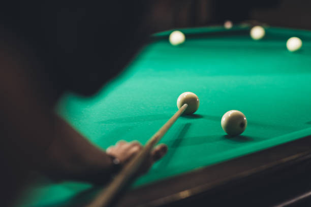 istock back view of cropped man playing in russian pool at bar 963533746
