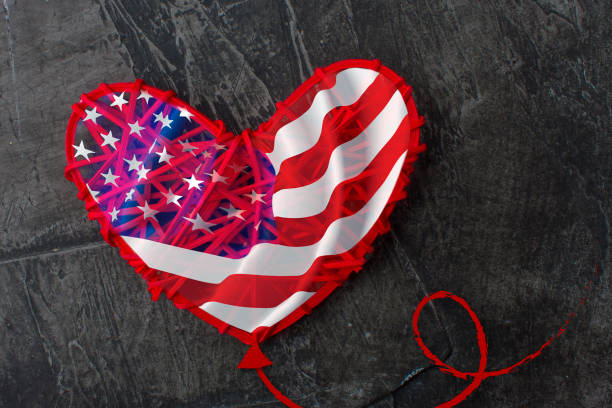 istock The American flag, like a heart shaped balloon 963533904