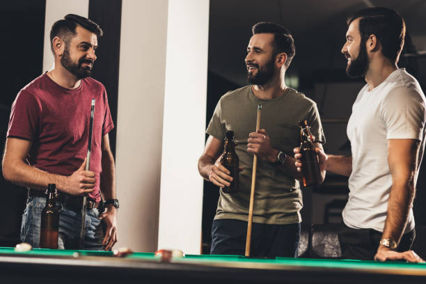 istock young handsome caucasian men beside billiard table in bar 963534940