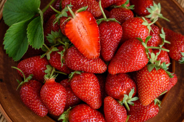 istock Tasty strawberry on a wooden table 963535218