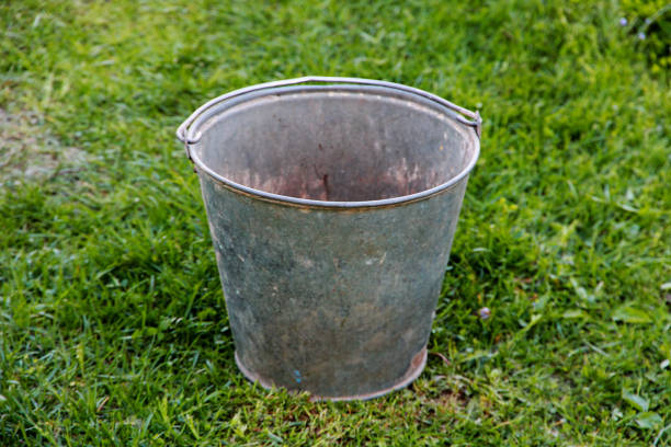 zinc bucket empty zinc bucket on green grass zinced steel stock pictures, royalty-free photos & images