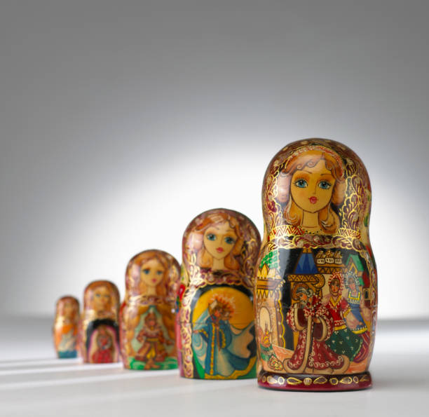 istock ROW OF FIVE RUSSIAN DOLLS ON WHITE BACKGROUND 963537422