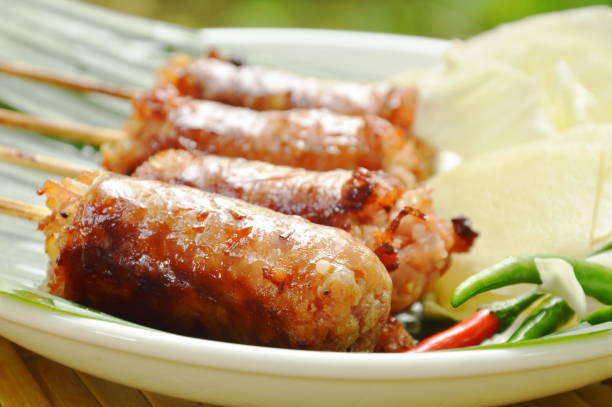 istock grilled Thai sausage stuffed rice and pork with fresh vegetable 963538446