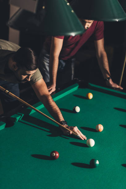 istock handsome caucasian man playing in pool 963539116