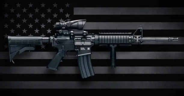 M4A1 Carbine with ACOG M150 optic commonly carried by US Military personnel, as well as US civilians in semi-auto configuration commonly known as the AR-15.  These were made by Colt Firearms and FN(Fabrique Nationale Herstal, FN America, FN Manufacturing).  Includes standard features such as pistol grip, Knights RAC forearm, collapsible stock, flash suppressor, and bayonet lug.