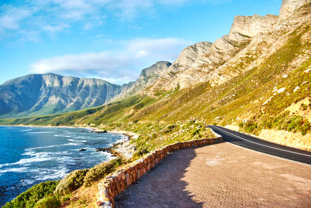istock Seaside road at sunset Boland Mountain Complex, Western Cape 963542578