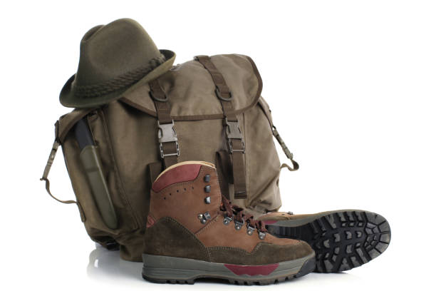 istock Backpack and other equipment for travelling isolated on white 963548400