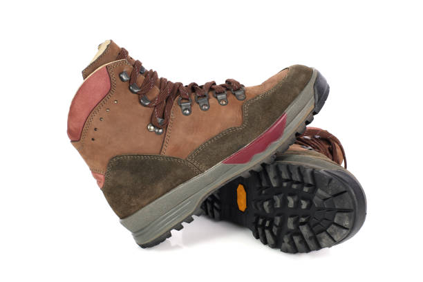 istock Hiking boots isolated on white background 963548750