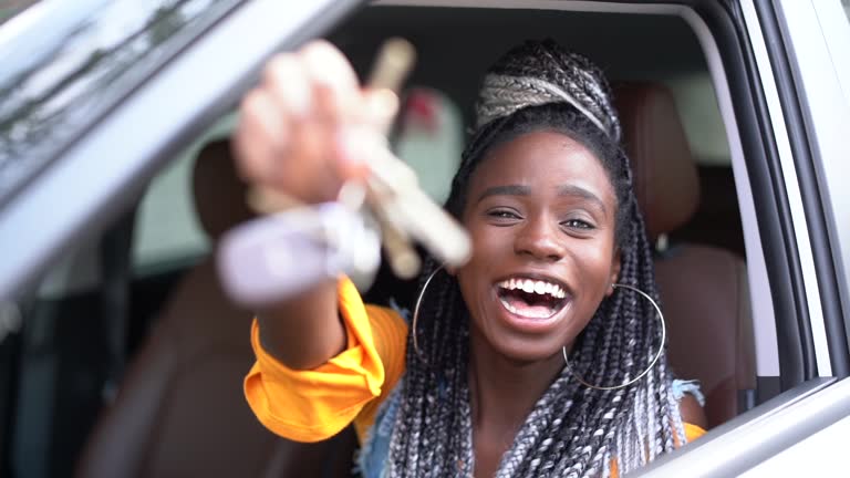 Young woman is excited about new car