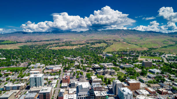 istock Idaho state capital building aerial view with foothills and large white cloud 963549092