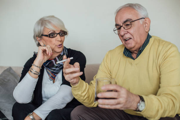 istock Angry senior couple in quarrel reading books 963549274