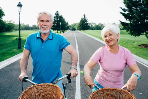 istock senior couple going for a bicycle ride in the park 963558742
