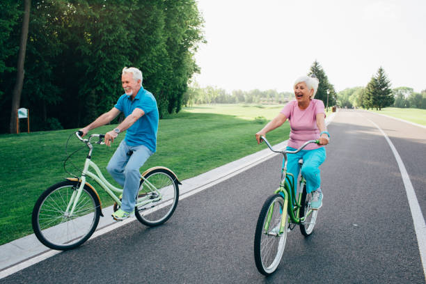 istock Older Caucasian couple riding bicycle 963558762