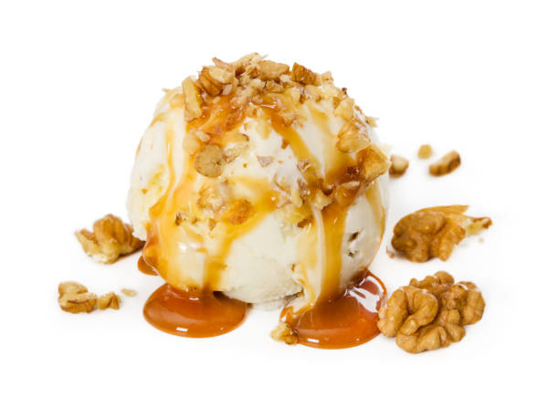 istock Vanilla ice cream with walnut and caramel isolated on white 963559716