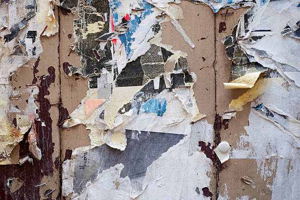 istock Paper leftovers on an old wooden wall 96356039
