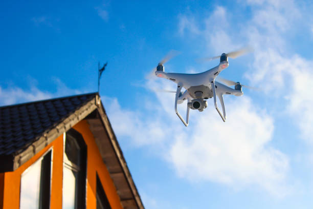 istock quadrocopter flying against the blue sky 963560740