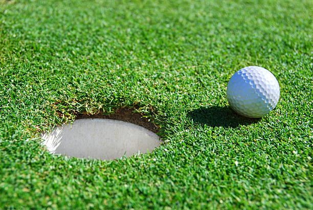 istock Golf Ball Next to Cup with Shallow Depth of Field 96356458