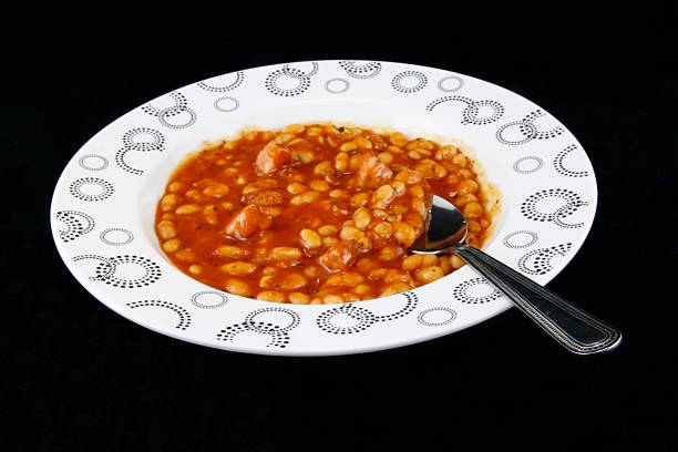 Beans and meat in the tomato  purée . stock photo