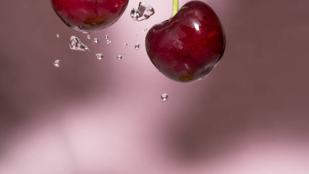 istock Isolated macro of cherry and water drops 963600862