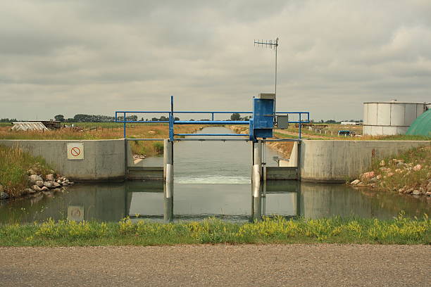 istock irrigation canal aquaduct gate on the prairies 96360349
