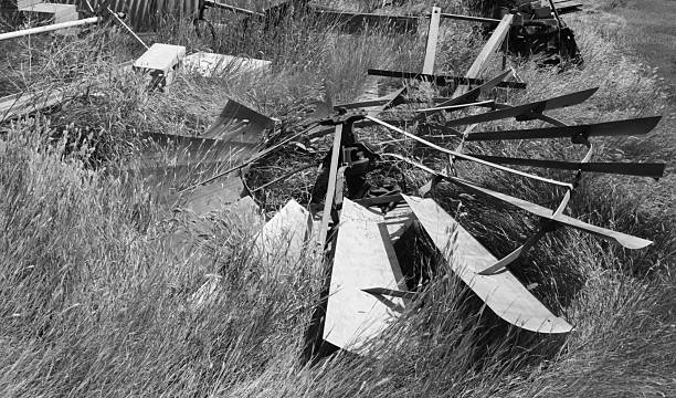 istock old windmill blades in the grass on farm B/W 96360388