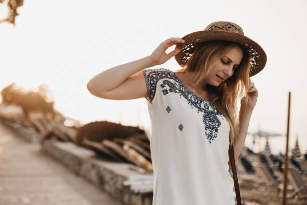 istock Young woman enjoying vacation at the seaside 963605482